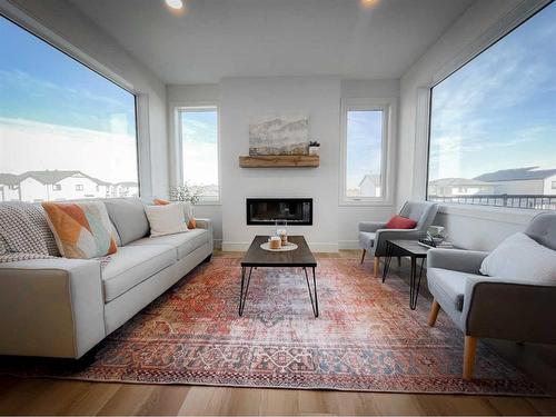 745 Violet Place West, Lethbridge, AB - Indoor Photo Showing Living Room With Fireplace