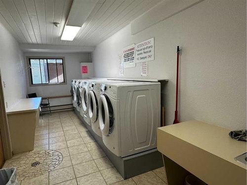 302-5015 51 Street, Taber, AB - Indoor Photo Showing Laundry Room