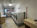 302-5015 51 Street, Taber, AB  - Indoor Photo Showing Laundry Room 