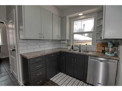 417 25 Street South, Lethbridge, AB - Indoor Photo Showing Kitchen With Double Sink