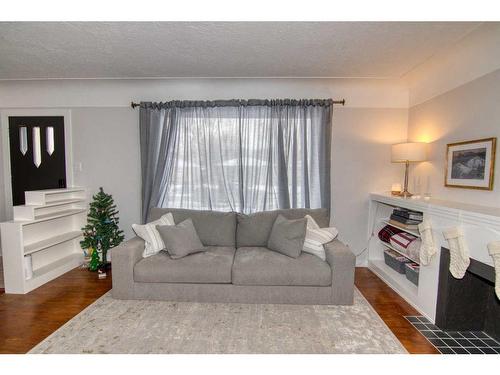 417 25 Street South, Lethbridge, AB - Indoor Photo Showing Living Room With Fireplace