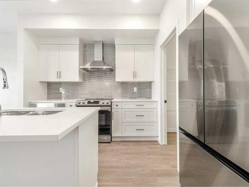 122 Blackwolf Pass North, Lethbridge, AB - Indoor Photo Showing Kitchen With Double Sink With Upgraded Kitchen