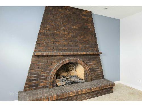 1409 Birch Place South, Lethbridge, AB - Indoor Photo Showing Living Room With Fireplace