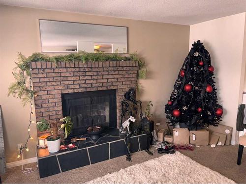 649 10 Street South, Lethbridge, AB - Indoor Photo Showing Living Room With Fireplace