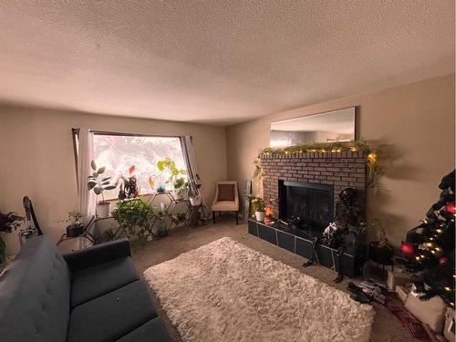 649 10 Street South, Lethbridge, AB - Indoor Photo Showing Living Room With Fireplace