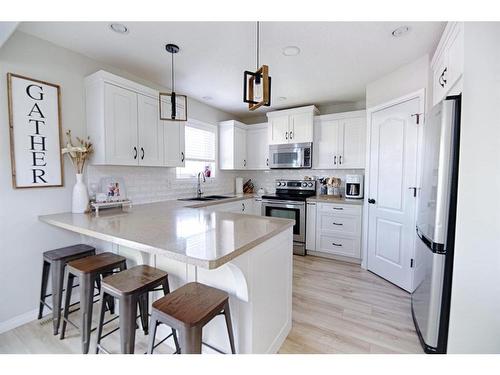 415 Haru Moriyama Place North, Lethbridge, AB - Indoor Photo Showing Kitchen With Upgraded Kitchen