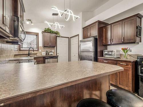 15 Jessie Ursenbach Way North, Lethbridge, AB - Indoor Photo Showing Kitchen With Double Sink