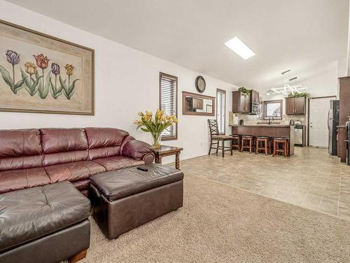 15 Jessie Ursenbach Way North, Lethbridge, AB - Indoor Photo Showing Living Room