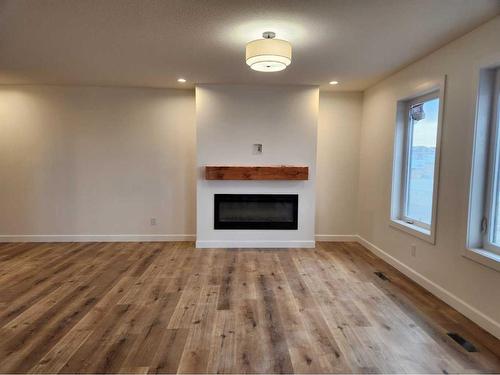 5404 44 A Street, Taber, AB - Indoor Photo Showing Living Room With Fireplace