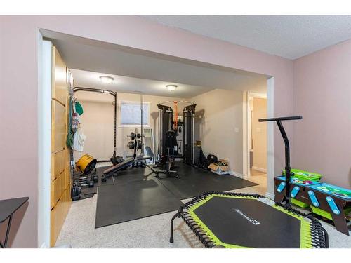 311 Barons Street, Nobleford, AB - Indoor Photo Showing Gym Room