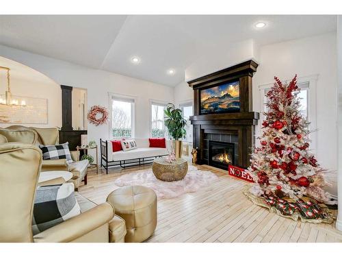 4 Heritage Point West, Lethbridge, AB - Indoor Photo Showing Living Room With Fireplace