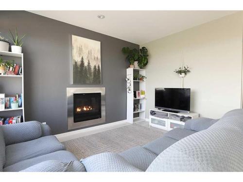 325 Rivergrove Chase West, Lethbridge, AB - Indoor Photo Showing Living Room With Fireplace