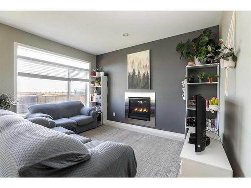 325 Rivergrove Chase West, Lethbridge, AB - Indoor Photo Showing Living Room With Fireplace