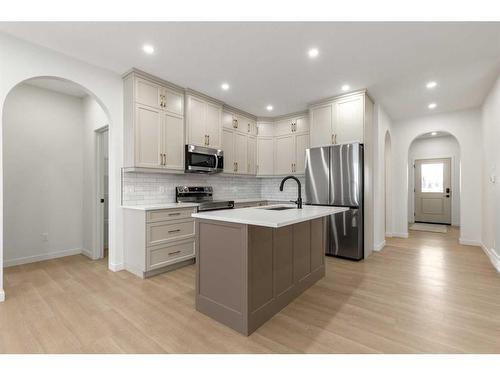 308 Bridge Crossing Close, Raymond, AB - Indoor Photo Showing Kitchen With Stainless Steel Kitchen With Upgraded Kitchen