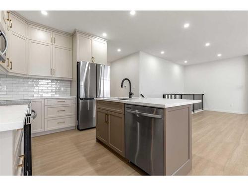 308 Bridge Crossing Close, Raymond, AB - Indoor Photo Showing Kitchen With Stainless Steel Kitchen With Upgraded Kitchen