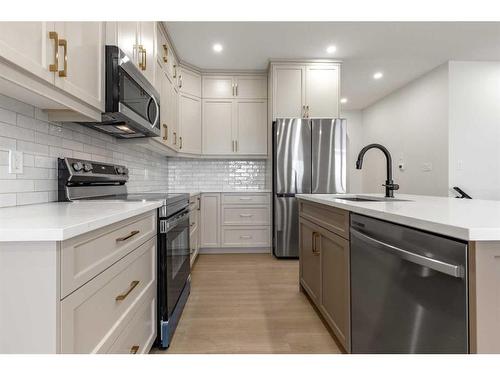 308 Bridge Crossing Close, Raymond, AB - Indoor Photo Showing Kitchen With Stainless Steel Kitchen With Upgraded Kitchen