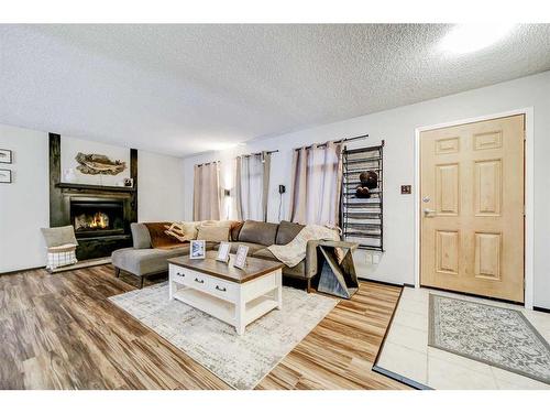 48 Cambridge Road West, Lethbridge, AB - Indoor Photo Showing Living Room With Fireplace