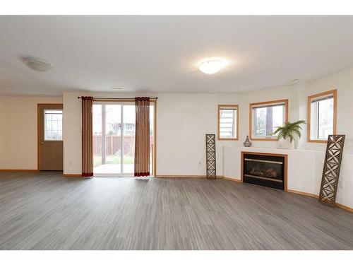 43 Riverdale Terrace West, Lethbridge, AB - Indoor Photo Showing Living Room With Fireplace