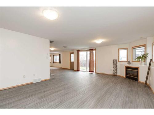 43 Riverdale Terrace West, Lethbridge, AB - Indoor Photo Showing Other Room With Fireplace