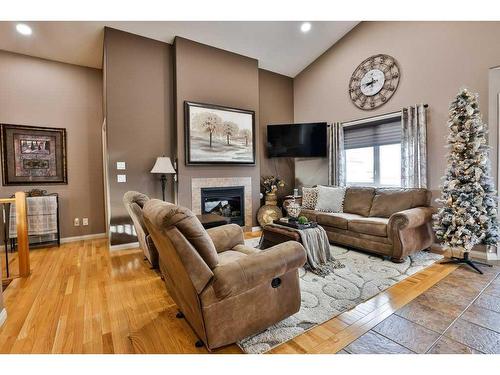 81 Salish Place West, Lethbridge, AB - Indoor Photo Showing Living Room With Fireplace