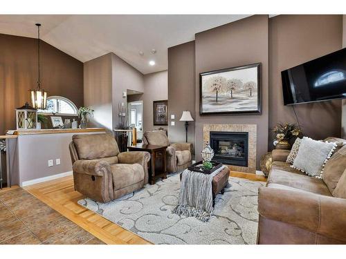 81 Salish Place West, Lethbridge, AB - Indoor Photo Showing Living Room With Fireplace