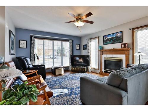 2 Ermineview Place North, Lethbridge, AB - Indoor Photo Showing Living Room With Fireplace