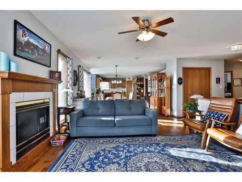 2 Ermineview Place North, Lethbridge, AB - Indoor Photo Showing Living Room With Fireplace