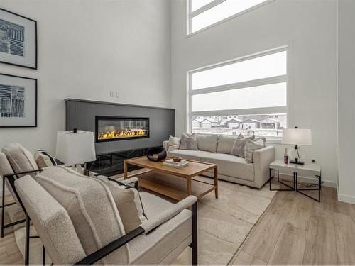 2911 47 Street South, Lethbridge, AB - Indoor Photo Showing Living Room With Fireplace