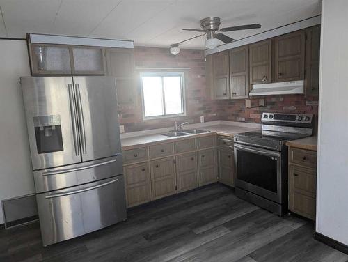 4825 Miners Road West, Coalhurst, AB - Indoor Photo Showing Kitchen With Double Sink