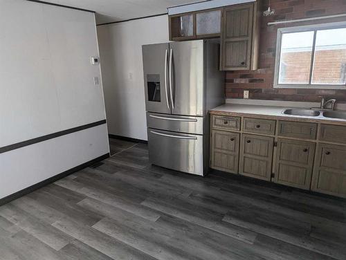 4825 Miners Road West, Coalhurst, AB - Indoor Photo Showing Kitchen With Double Sink