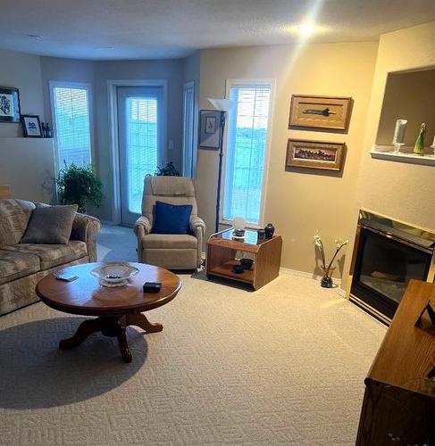 157 Stafford Boulevard North, Lethbridge, AB - Indoor Photo Showing Living Room With Fireplace