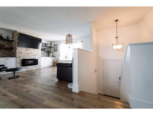 23 Red Crow Boulevard West, Lethbridge, AB - Indoor Photo Showing Living Room With Fireplace