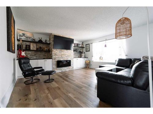 23 Red Crow Boulevard West, Lethbridge, AB - Indoor Photo Showing Living Room With Fireplace