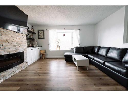 23 Red Crow Boulevard West, Lethbridge, AB - Indoor Photo Showing Living Room With Fireplace