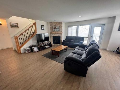 61 Ironstone Drive, Coleman, AB - Indoor Photo Showing Living Room With Fireplace