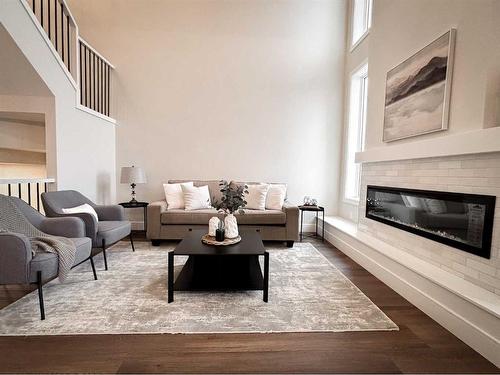 2714 43Rd Street South, Lethbridge, AB - Indoor Photo Showing Living Room With Fireplace