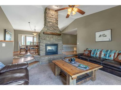 84053 Range Road 21-1, Rural Lethbridge County, AB - Indoor Photo Showing Living Room With Fireplace