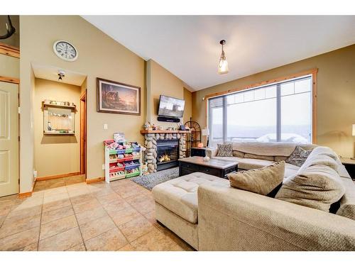 11 Ironstone Dr, Coleman, AB - Indoor Photo Showing Living Room With Fireplace