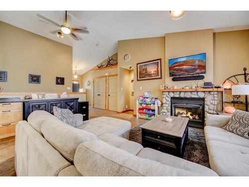 11 Ironstone Dr, Coleman, AB - Indoor Photo Showing Living Room With Fireplace