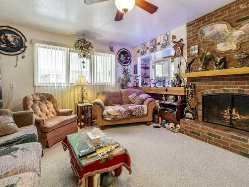 33 Nevada Road West, Lethbridge, AB - Indoor Photo Showing Living Room With Fireplace