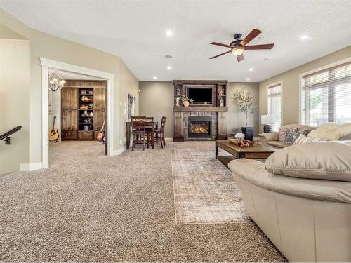 496 Arbourwood Terrace South, Lethbridge, AB - Indoor Photo Showing Living Room With Fireplace