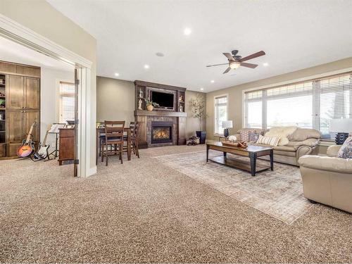 496 Arbourwood Terrace South, Lethbridge, AB - Indoor Photo Showing Living Room With Fireplace