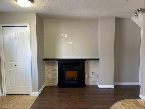 1415 Lakemount Boulevard South, Lethbridge, AB - Indoor Photo Showing Living Room With Fireplace