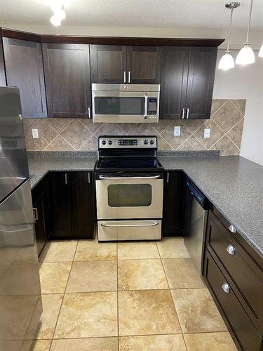 1415 Lakemount Boulevard South, Lethbridge, AB - Indoor Photo Showing Kitchen With Stainless Steel Kitchen