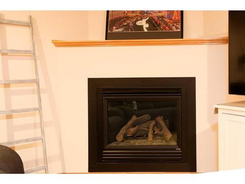 106 Bonavista Drive, Rural Lethbridge County, AB - Indoor Photo Showing Living Room With Fireplace