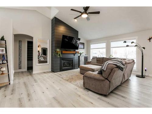 106 Bonavista Drive, Rural Lethbridge County, AB - Indoor Photo Showing Living Room With Fireplace