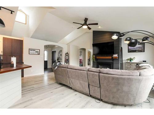 106 Bonavista Drive, Rural Lethbridge County, AB - Indoor Photo Showing Living Room With Fireplace