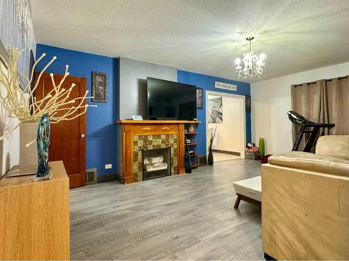 815 13 Street South, Lethbridge, AB - Indoor Photo Showing Living Room With Fireplace