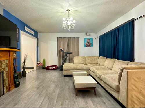 815 13 Street South, Lethbridge, AB - Indoor Photo Showing Living Room With Fireplace