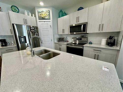 408-210 Firelight Way West, Lethbridge, AB - Indoor Photo Showing Kitchen With Stainless Steel Kitchen With Double Sink